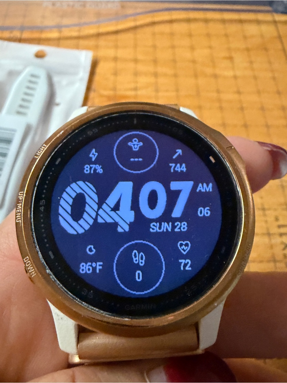 garmin rose gold and white smartwatch